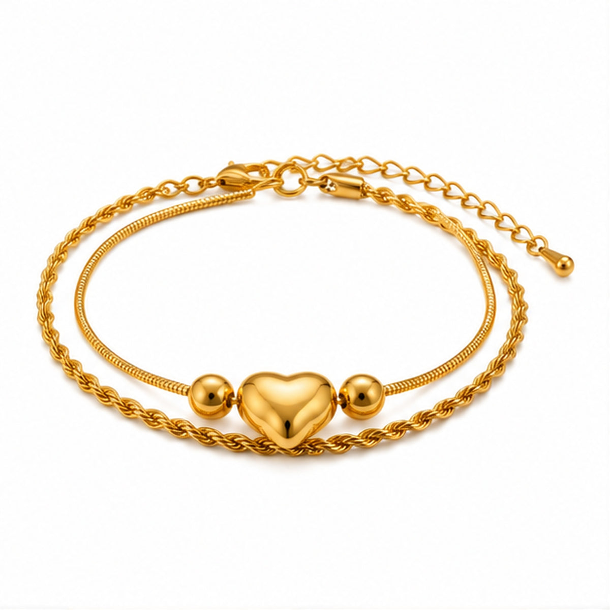 Gold heart bracelet on plain white background