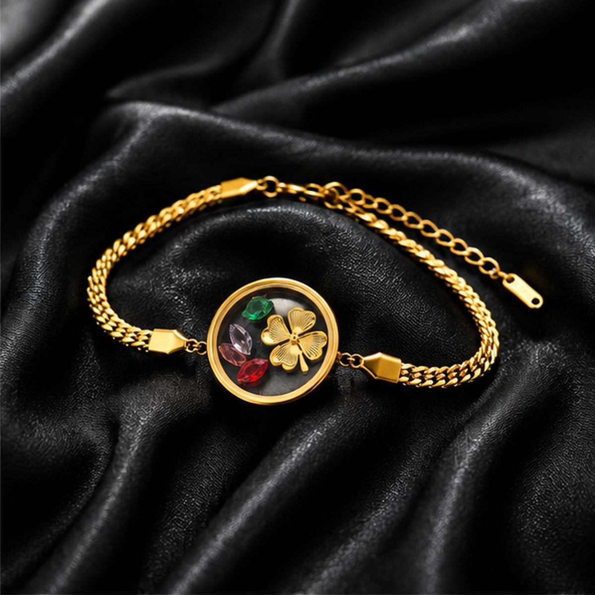 Floral charm gold bracelet on black satin