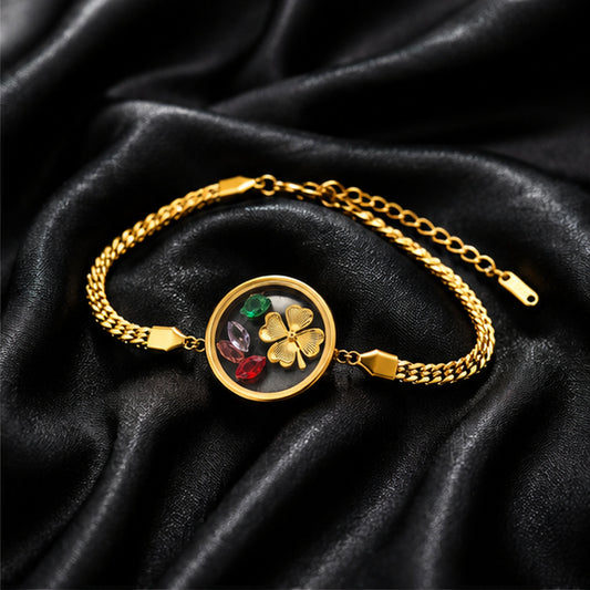 Floral charm gold bracelet on black satin