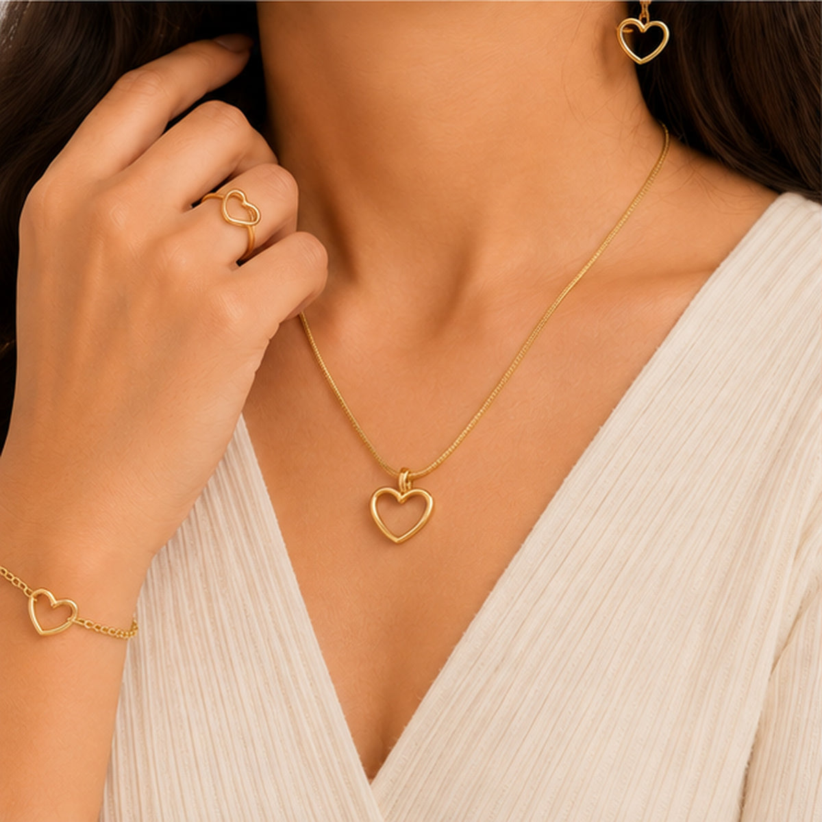 Woman wearing gold heart jewellery combo