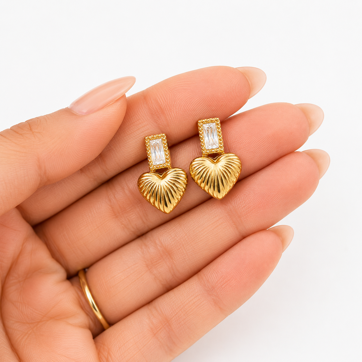 PRISA Heart Crystal Drop Earrings held in hand