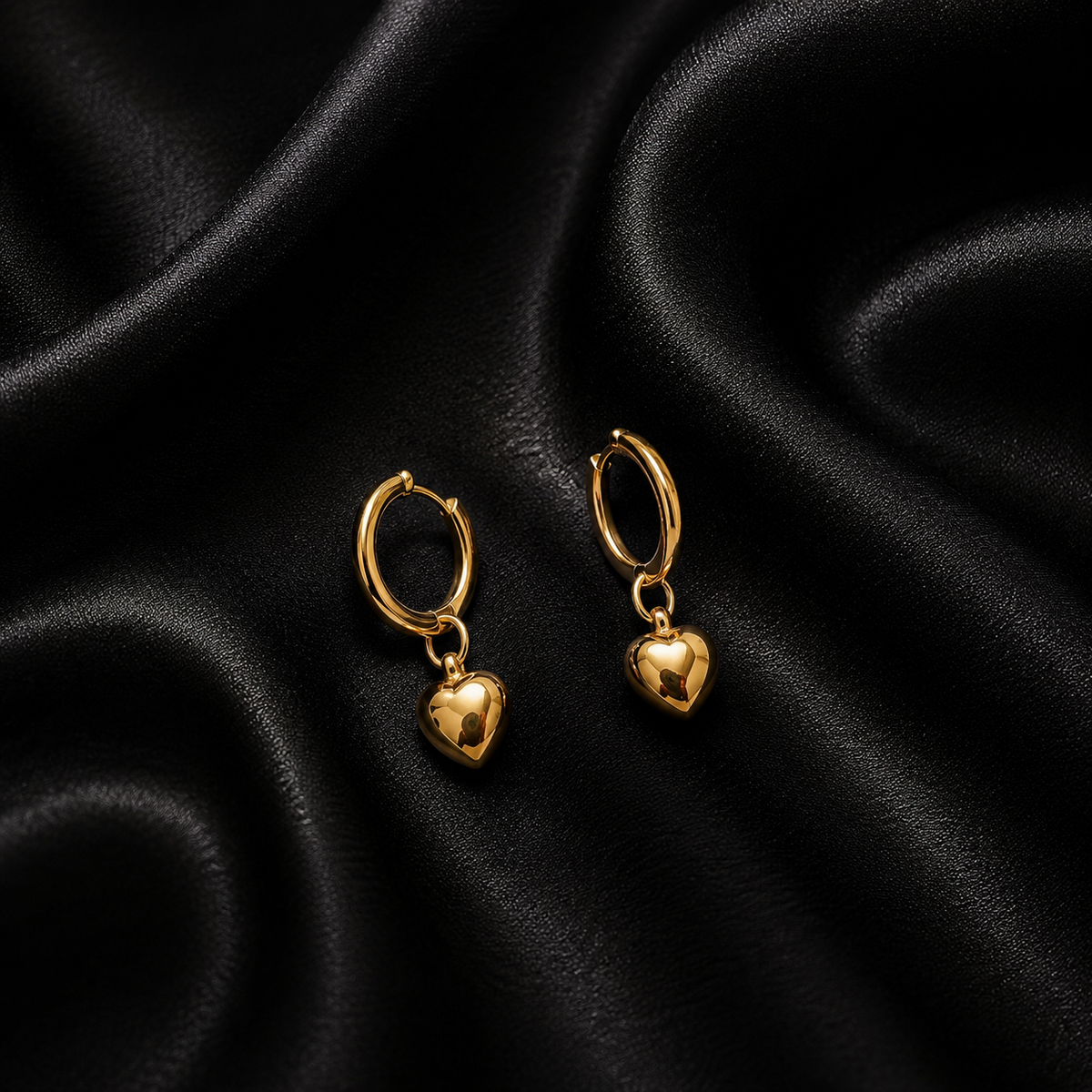 PRISA Gold Heart Hoop Drop Earrings on black satin
