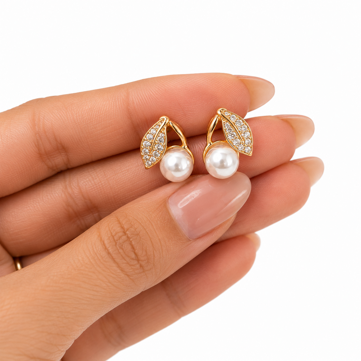 PRISA Pearl Leaf Drop Earrings held in hand