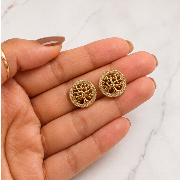 PRISA Tree of Life Stud Earrings held in hand