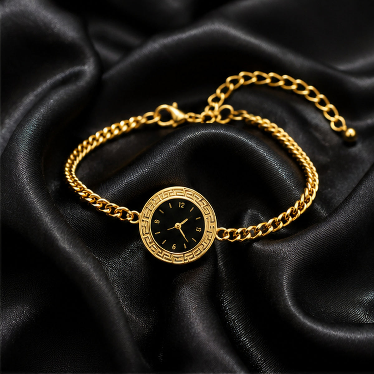 Gold watch-style bracelet on black satin